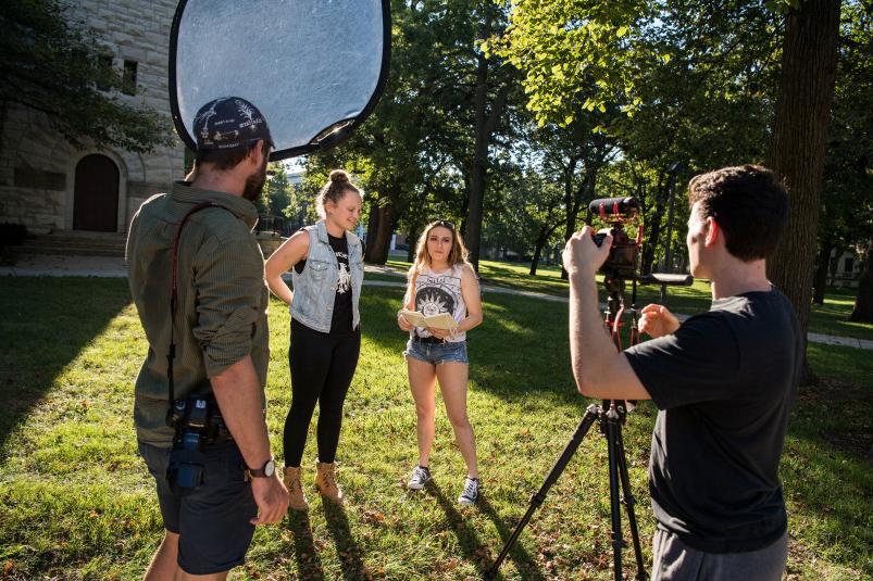 Beloit students film a video on the Beloit College campus.