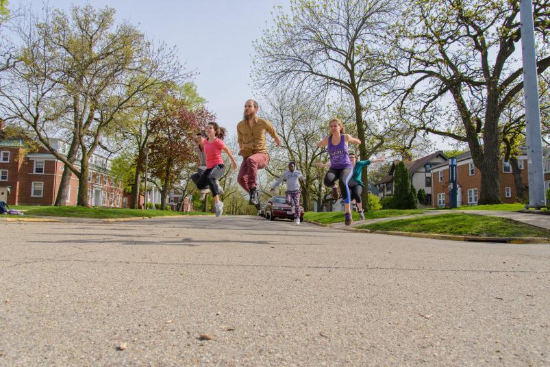 Dance students perform on College Street, by the 